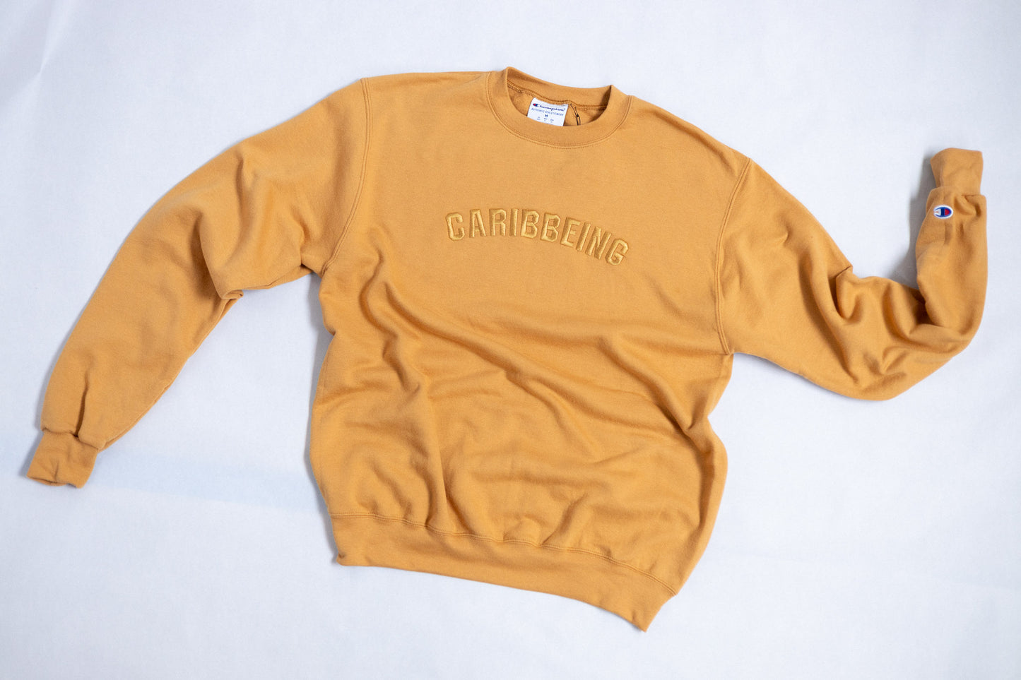 
                  
                    CaribBeing Gold Crewneck Limited Edition
                  
                