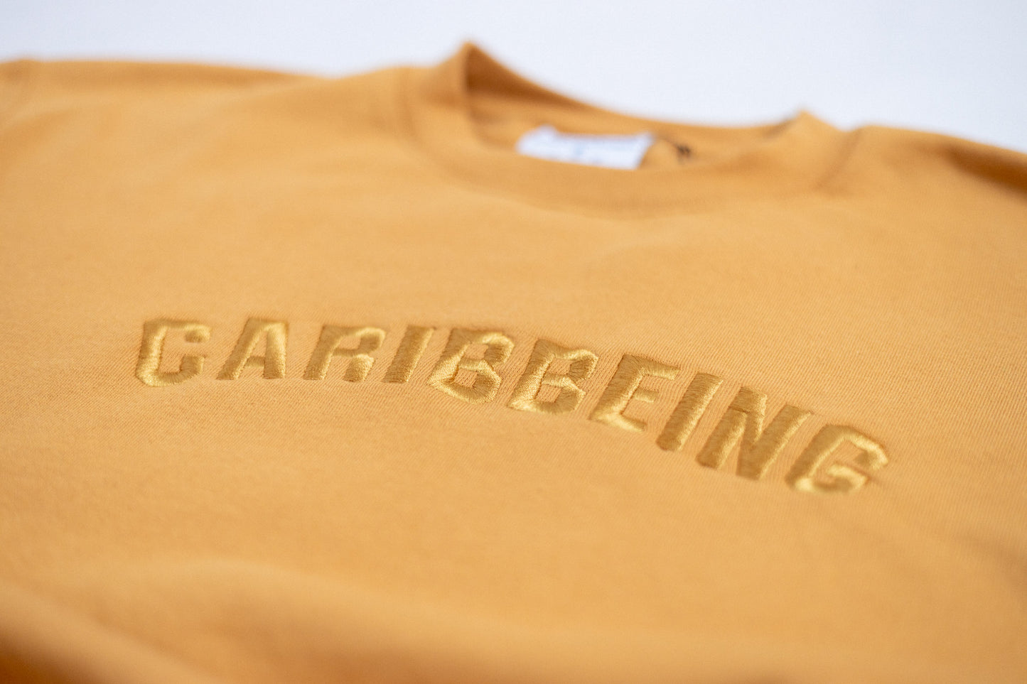 
                  
                    CaribBeing Gold Crewneck Limited Edition
                  
                